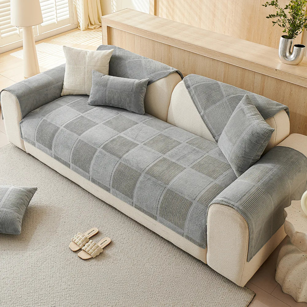 Stylish geometric pattern on a plush sofa cover, provides all-season protection and a non-slip grip.