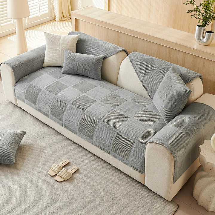 Stylish geometric pattern on a plush sofa cover, provides all-season protection and a non-slip grip.