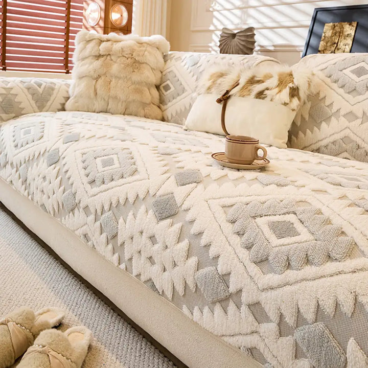Vibrant geometric pattern on a soft plush sofa cover, modern and protective.
