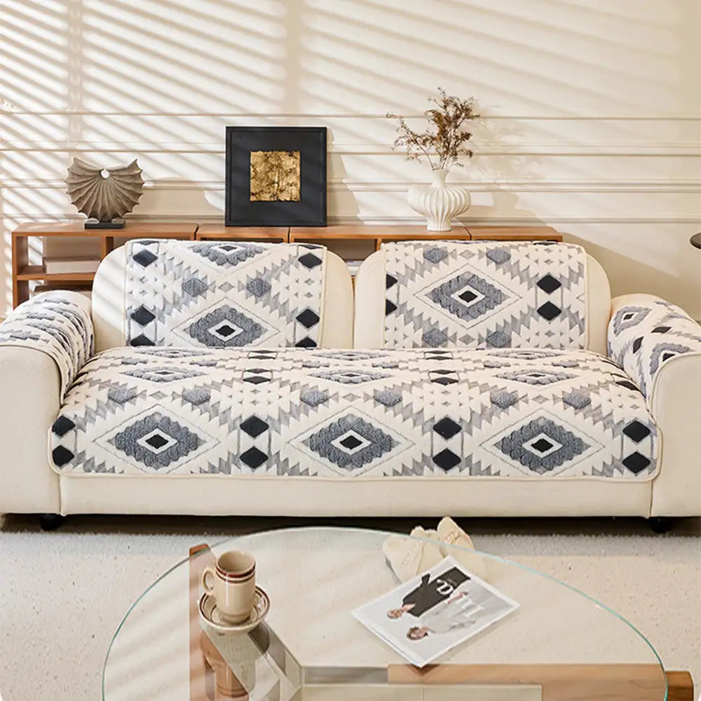 Non-slip plush geometric sofa cover securely fitted, providing excellent furniture protection.