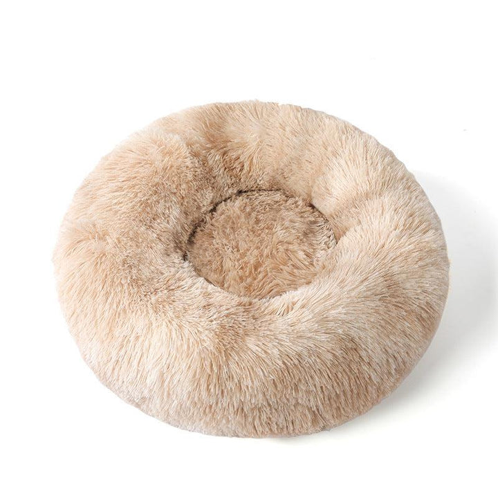 Unisex calming pet bed in neutral tones, blending with home decor, promotes deep sleep.