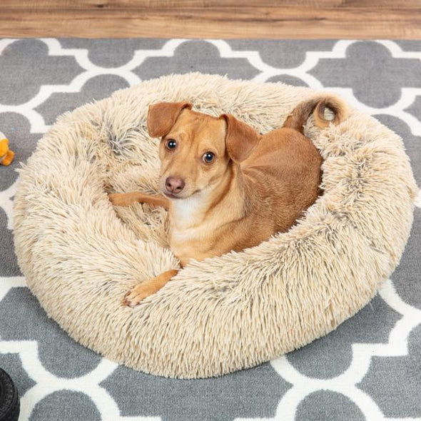 Pet bed material close-up: long-pile faux fur for ultimate warmth and deep sleep.