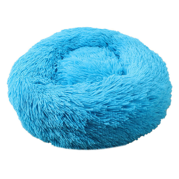 Child affectionately petting a dog in its anti-anxiety deep sleep pet bed, cozy scene.