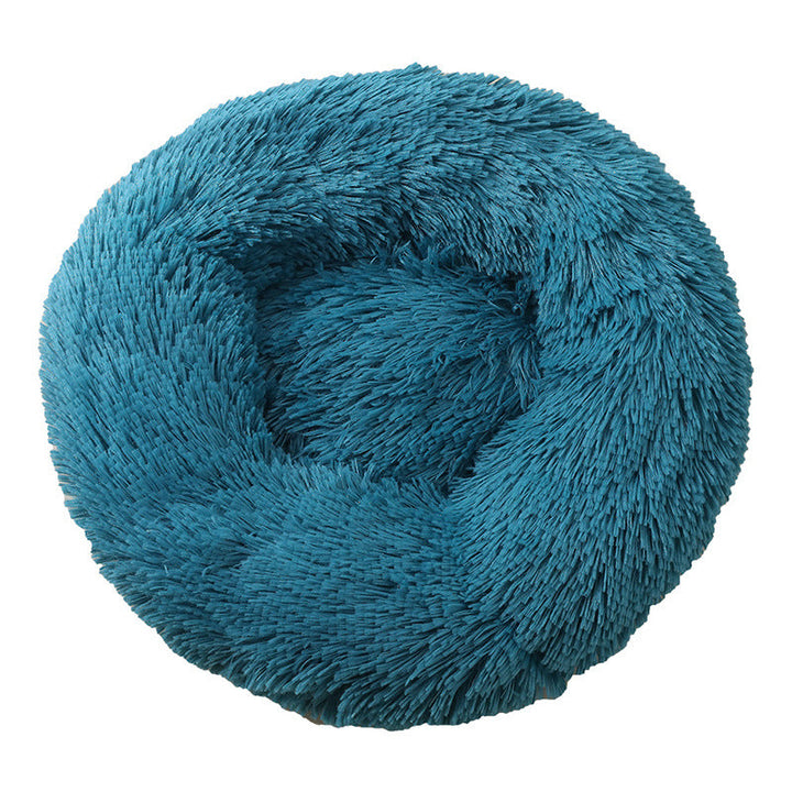 Pet bed in vibrant blue, adding a pop of color, designed for anti-anxiety deep sleep.