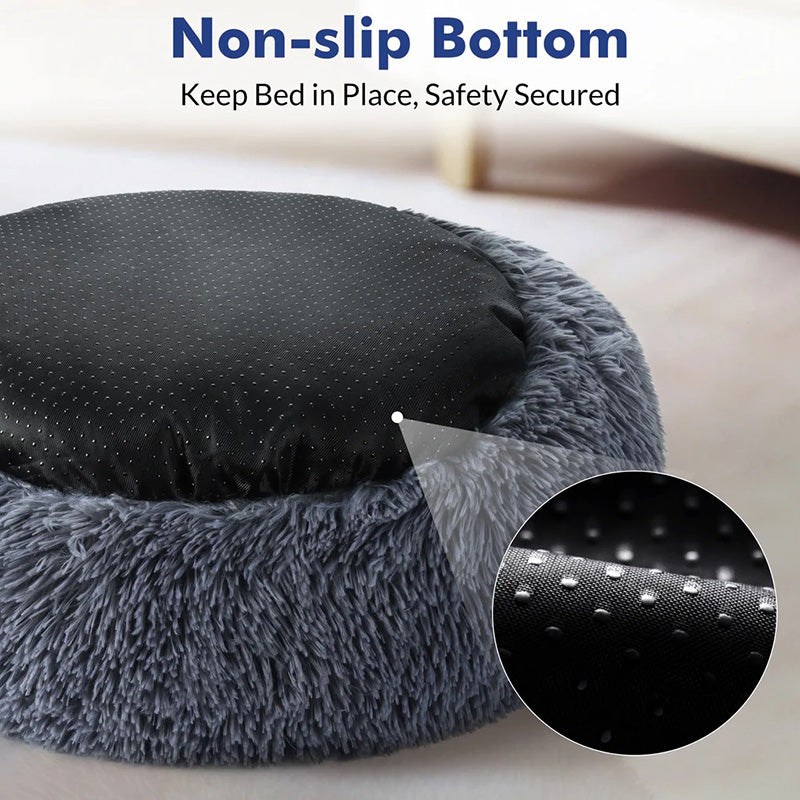 Small dog peacefully sleeping in a round anti-anxiety calming pet bed, deep sleep.