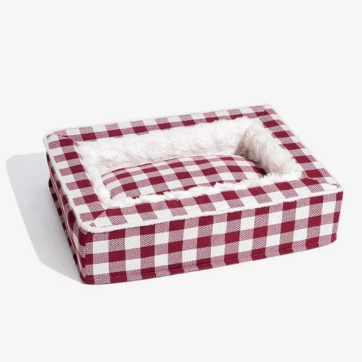 Top-down view of a round calming dog bed, memory foam, perfect for anti-anxiety support