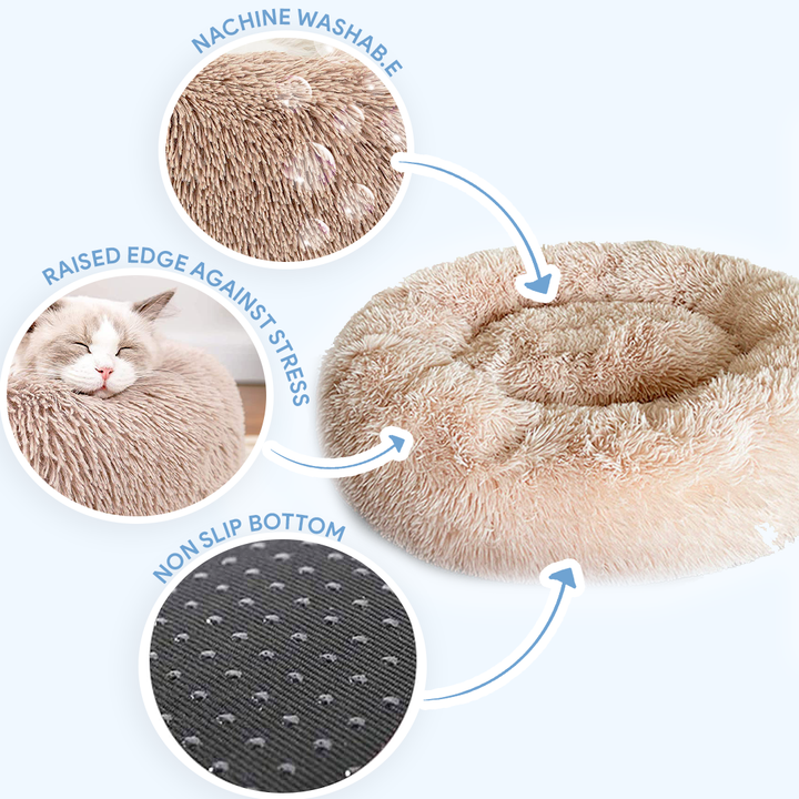 Comforting grey donut cat bed, designed with a raised rim for anxiety relief