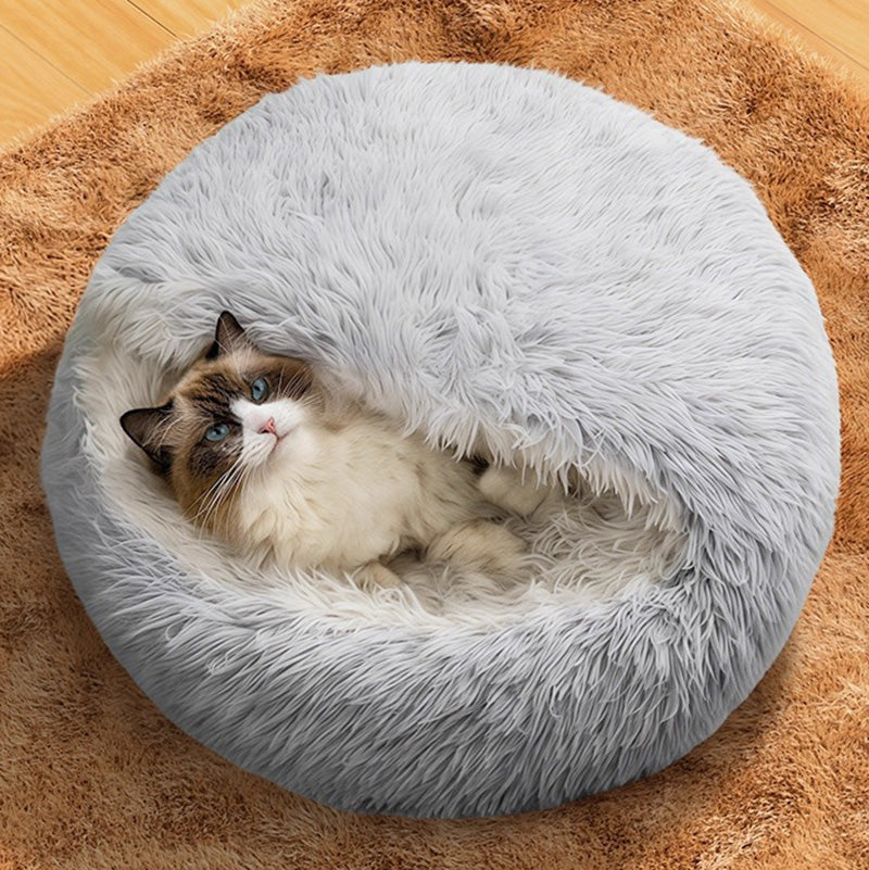 Plush grey calming cat nest bed for indoor cats, providing comfort and anxiety relief