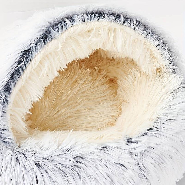 Happy cat napping soundly in a comfortable, deep-walled pet nest bed