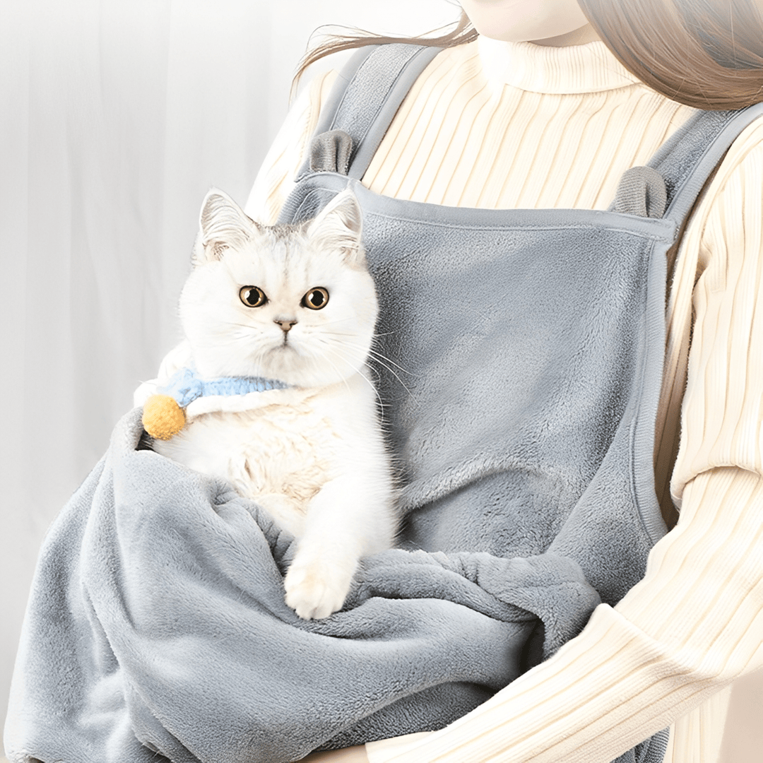 Plush grey cat carrier sling with cat peeking out, hands-free pet travel accessory