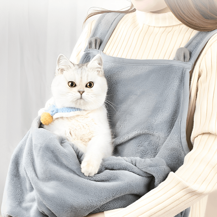 Plush grey cat carrier sling with cat peeking out, hands-free pet travel accessory