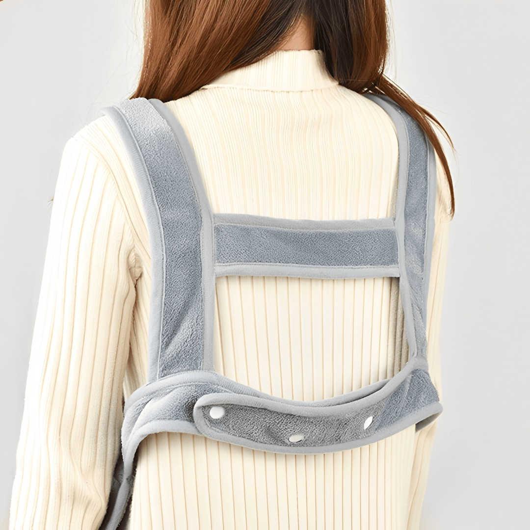 Portable plush pet sling in pink, designed for comfortable hands-free cat carrying
