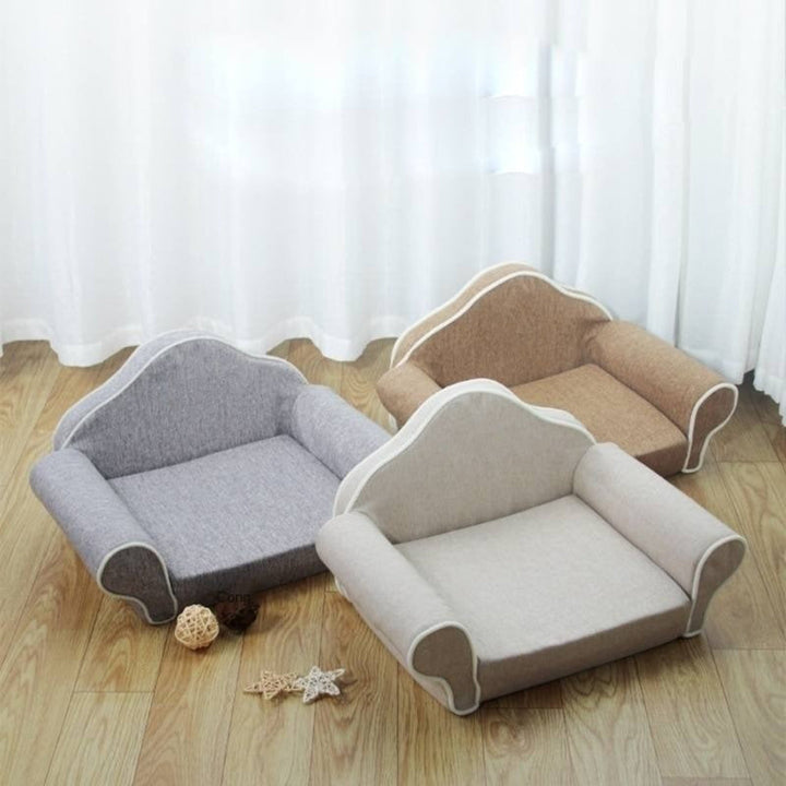 Plush grey cat sofa bed with elevated sides, a soft comfort lounger for indoor pets.