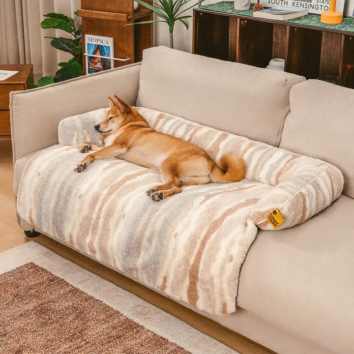 Plush dog bed transforming a sofa into a pet-friendly zone, stylish and functional.