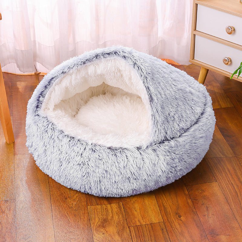 Beige anti-anxiety pet bed with raised rim providing head and neck support, washable dog/cat bed.
