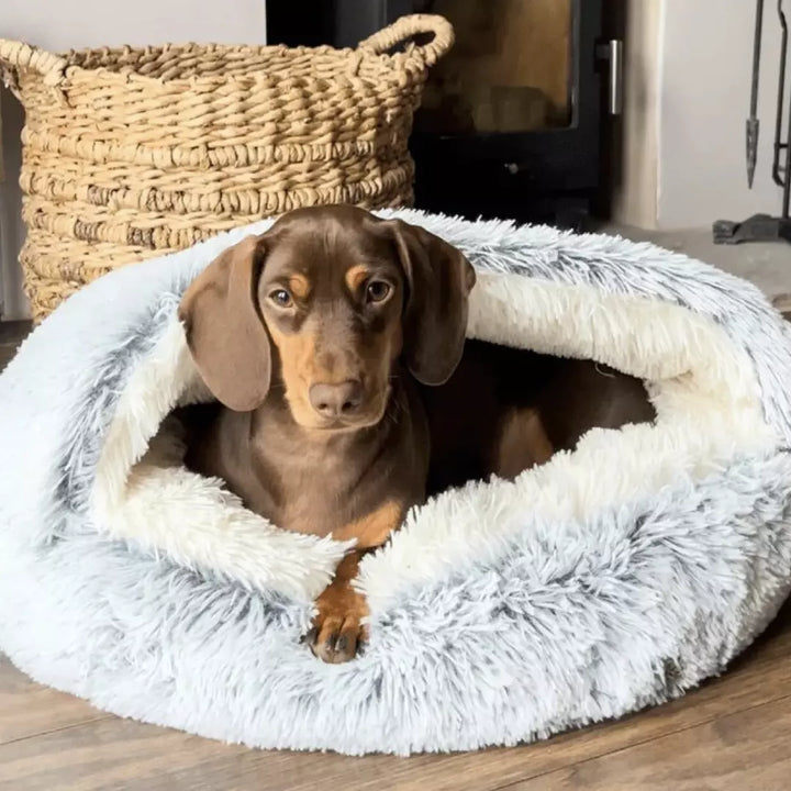 Close-up of the luxurious, soft faux fur material of the anti-anxiety pet bed, ultimate comfort.