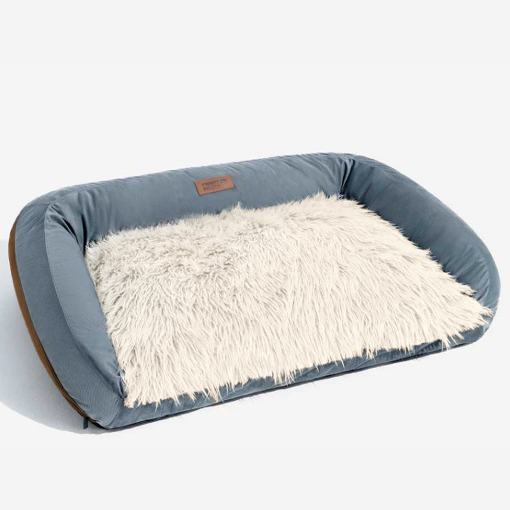 Washable dog bed with a pet's favorite toy, illustrating it as a comfort zone for pets.
