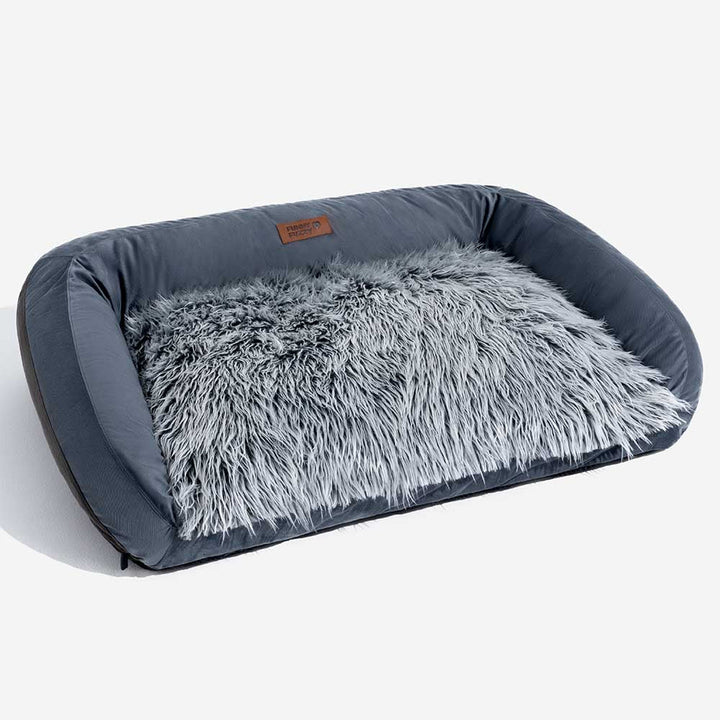 Fluffy bolster dog bed in a neutral color, suitable for various home interiors.
