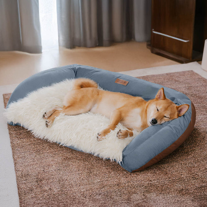 Beige fluffy dog sofa bed with bolster, providing ultimate comfort for large dogs.