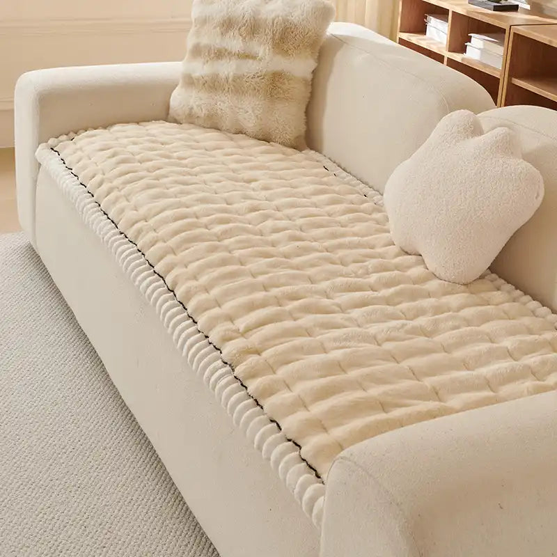 Plush grey fluffy sofa cover, pet-friendly and anti-slip. Protects furniture.
