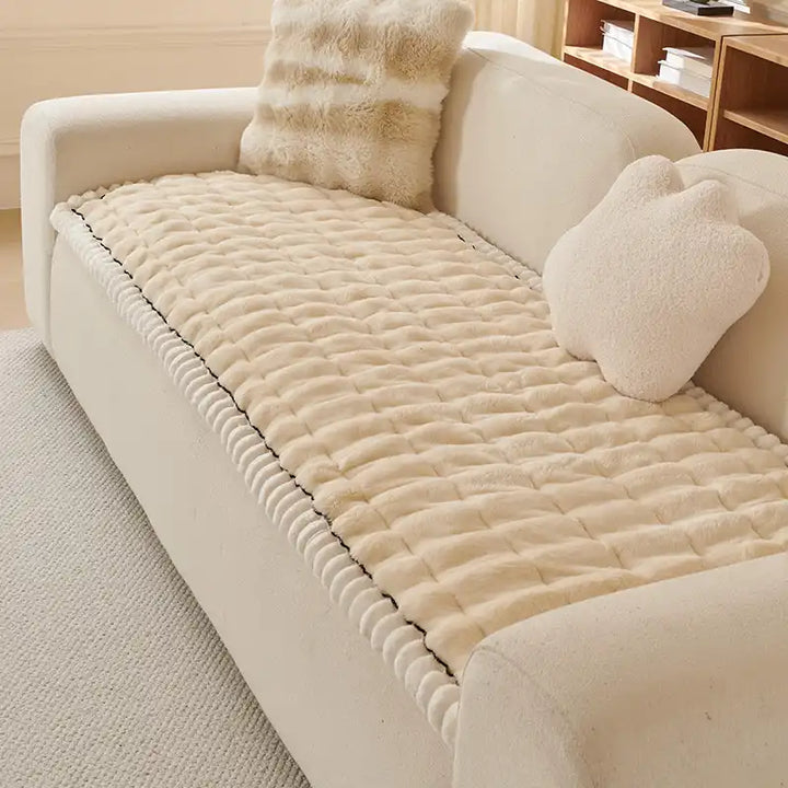 Plush grey fluffy sofa cover, pet-friendly and anti-slip. Protects furniture.