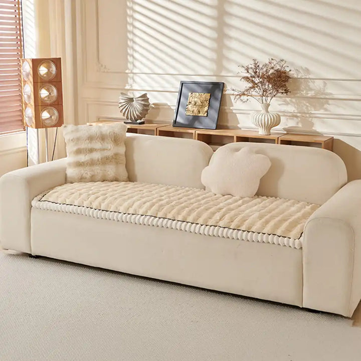 Detail of the anti-slip backing on a fluffy couch cover for secure fit.