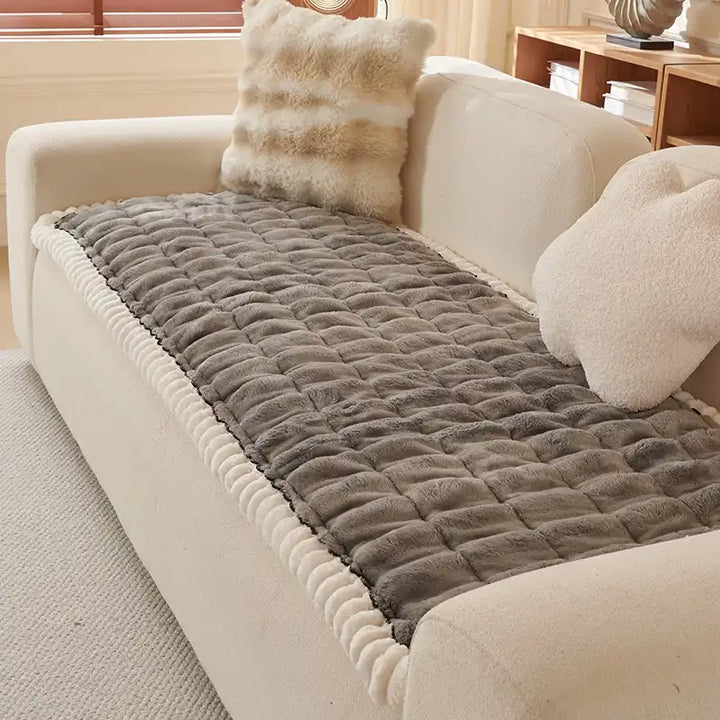 Soft white solid color fluffy couch cover, machine washable for home decor.