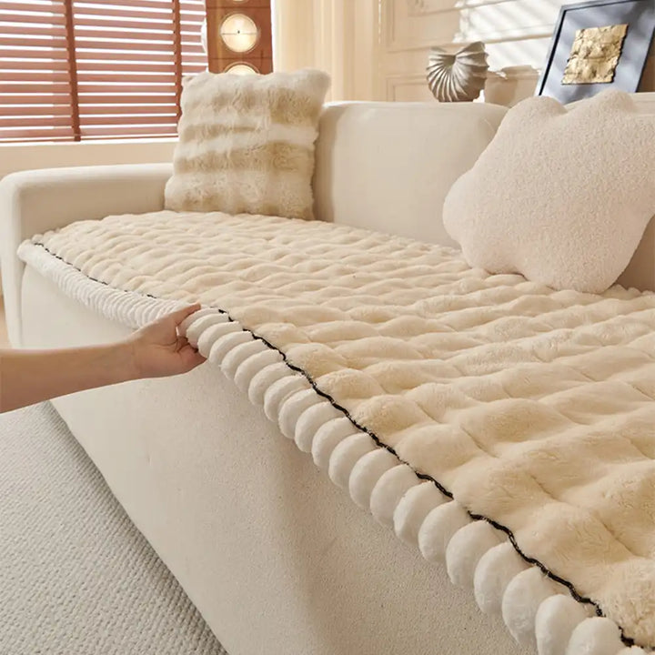 Olive green solid color fluffy couch cover, luxurious home decor accent.