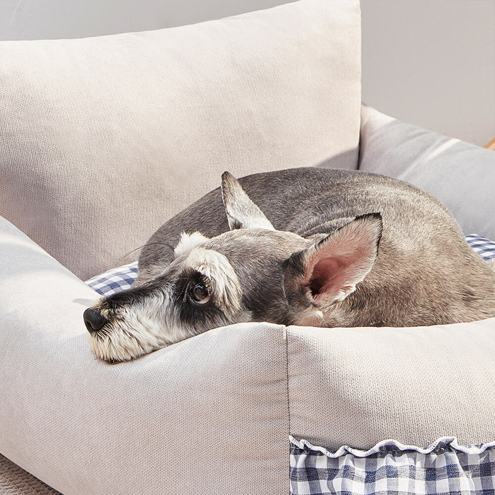 Cozy pet sofa bed, washable and durable, featuring a chic ruffled backrest for ultimate pet comfort.
