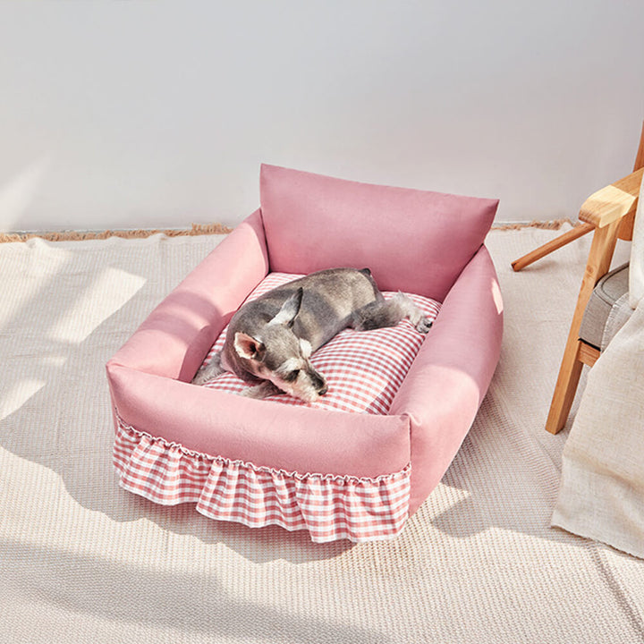 Soft pet bed with unique ruffled backrest design, offering a secure and stylish spot for a dog or cat.