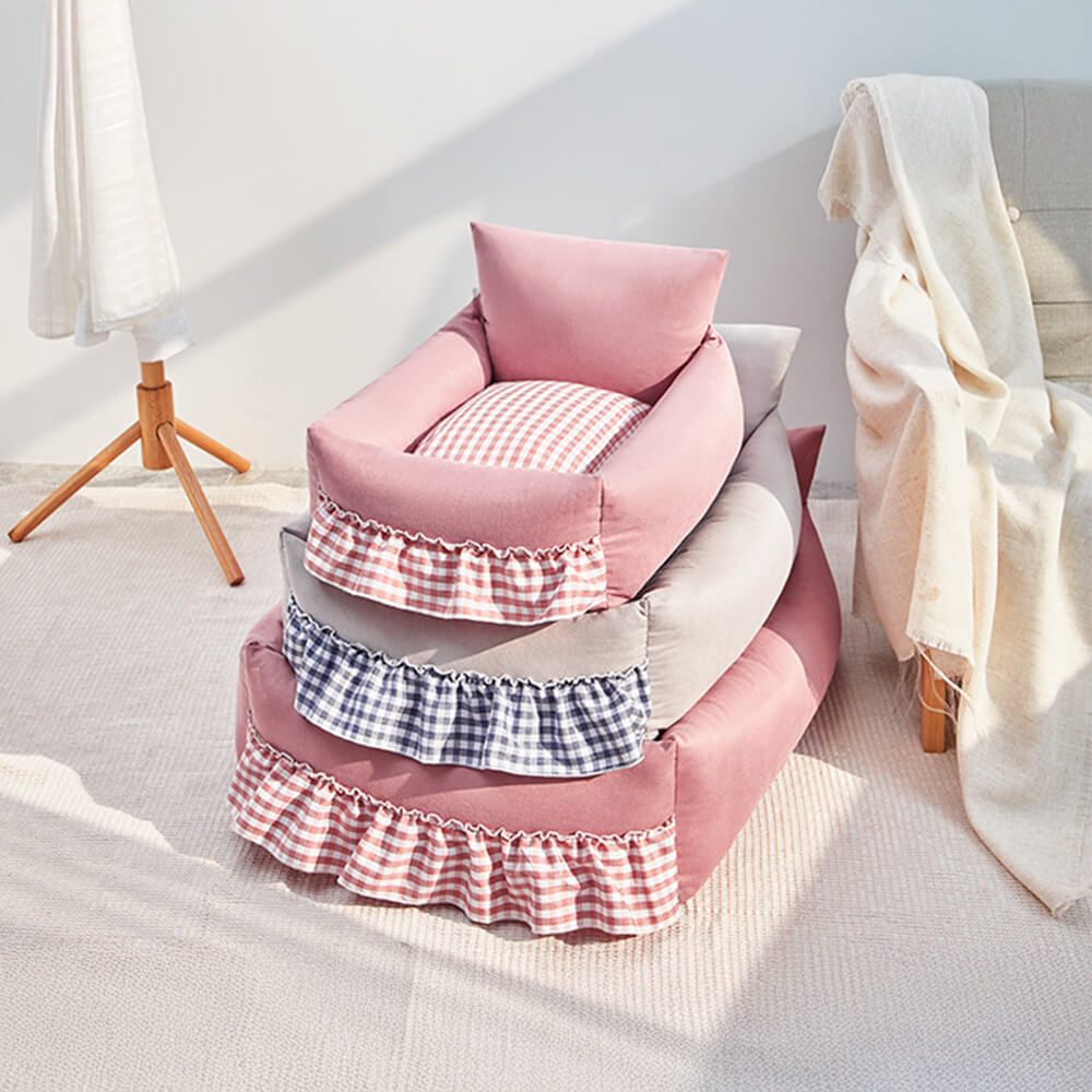 Washable pet sofa bed with elegant ruffled back, ensuring a clean and comfy retreat for your pet.