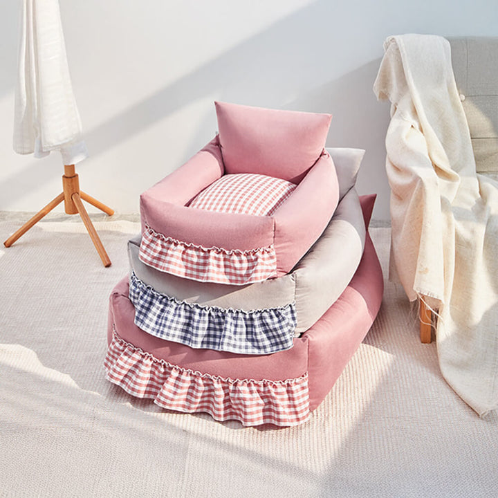 Washable pet sofa bed with elegant ruffled back, ensuring a clean and comfy retreat for your pet.