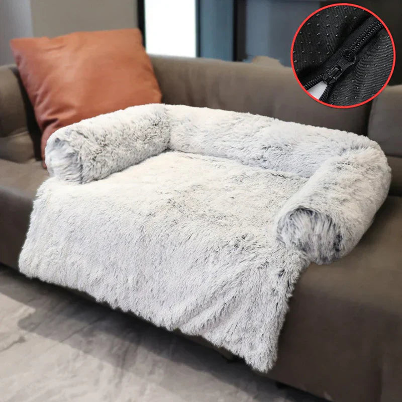 A pampered dog resting peacefully on a luxurious grey pet sofa bed, showcasing ample space and comfort