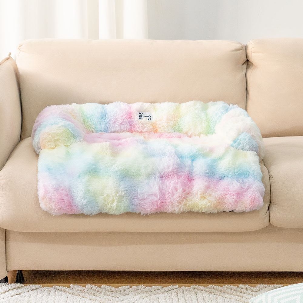 Side view of a fluffy grey pet sofa protector and calming dog bed mat, plush couch cover
