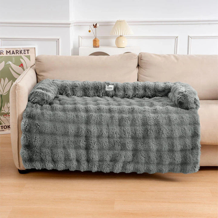 Beige pet sofa protector & calming dog bed mat on a couch, non-slip design for pet furniture