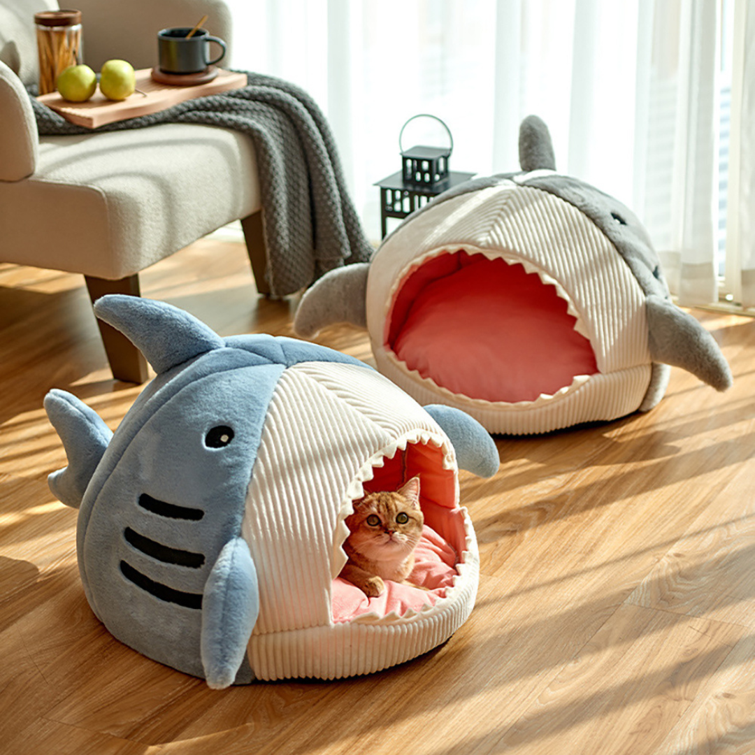 Plush grey shark cave cat bed with soft cushion, ideal for cozy pet naps