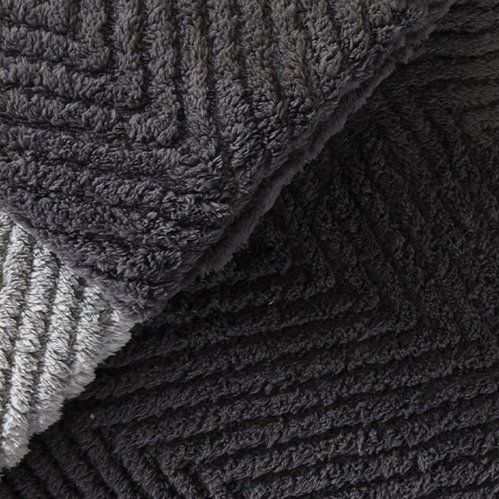 Close-up of a luxurious plush herringbone cushion cover, ideal for home decor