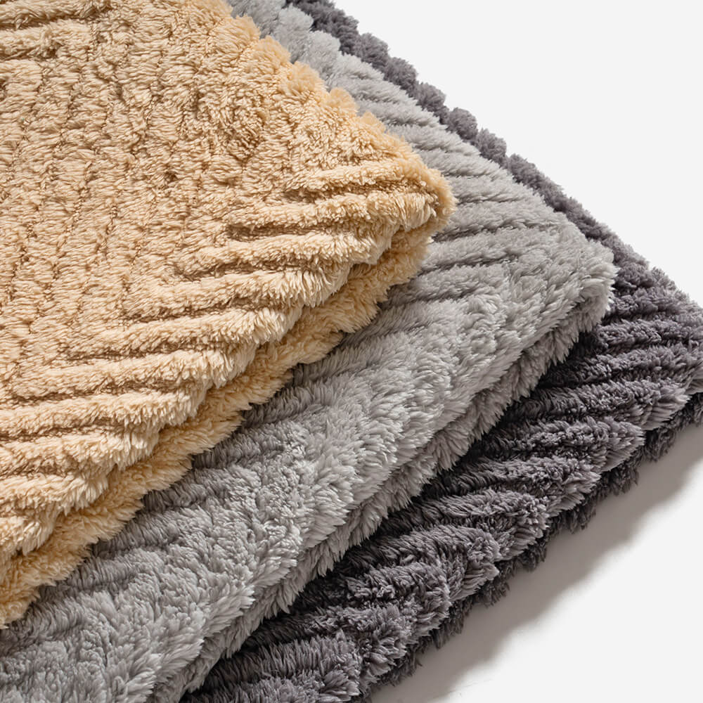 Detail of the woven plush herringbone pattern on a durable cushion cover for sofas