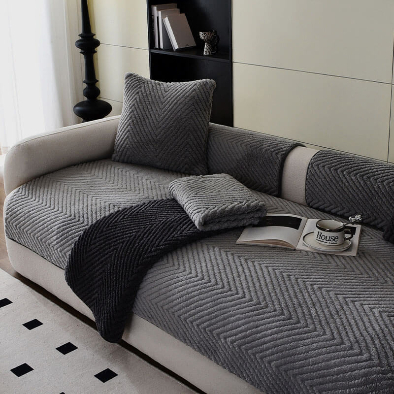 Plush herringbone non-slip sofa cover in grey, offering home comfort and furniture protection