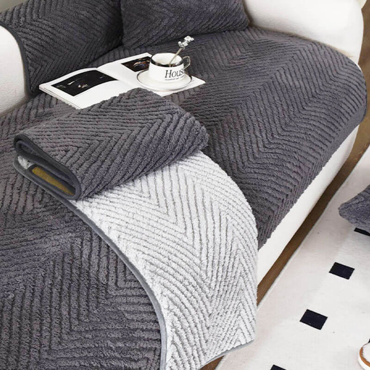 Detail of the non-slip backing on a plush herringbone couch cover, ensuring a snug fit