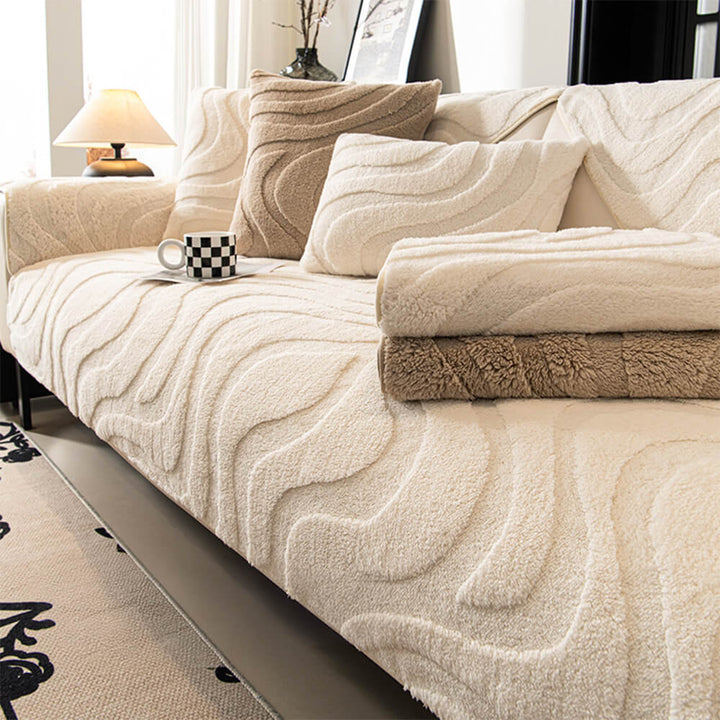 Plush jacquard non-slip sofa cover in beige, protecting living room furniture.