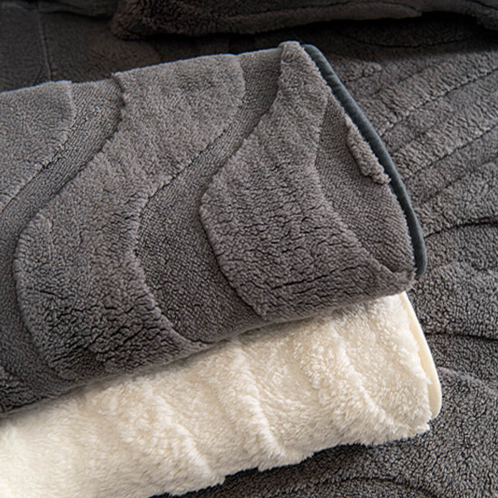 Warm and soft plush jacquard non-slip sofa cover, perfect for cozy living rooms.