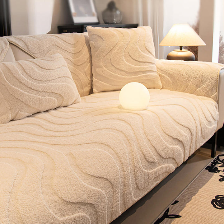 Detailed pattern of plush jacquard fabric on a non-slip sofa cover, elegant.