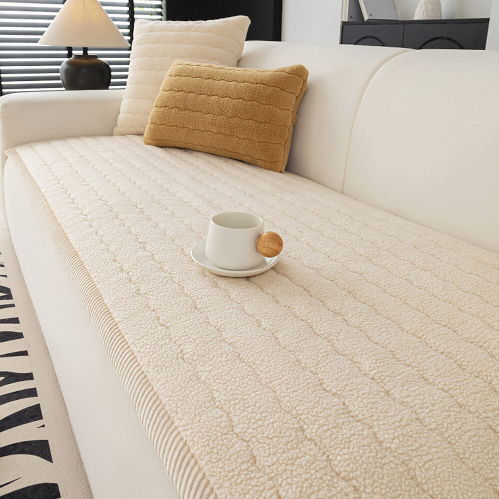 Modern home decor featuring a plush lambskin feel couch cover on a minimalist sofa