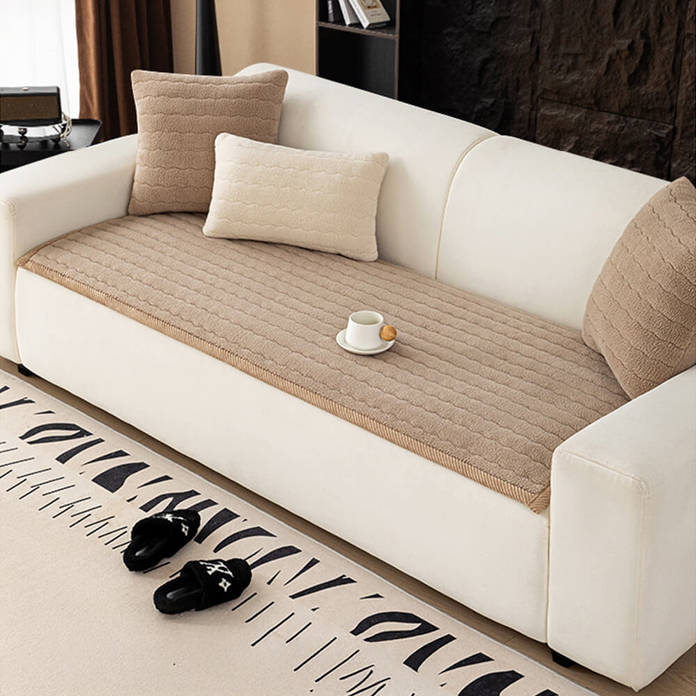 Stylish plush lambskin feel couch throw adding a layer of luxury to any living room
