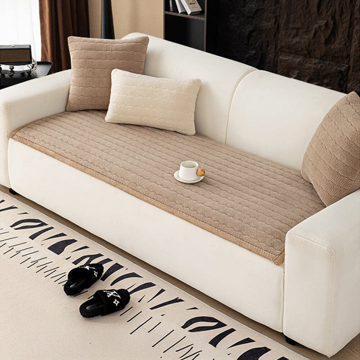 Stylish plush lambskin feel couch throw adding a layer of luxury to any living room