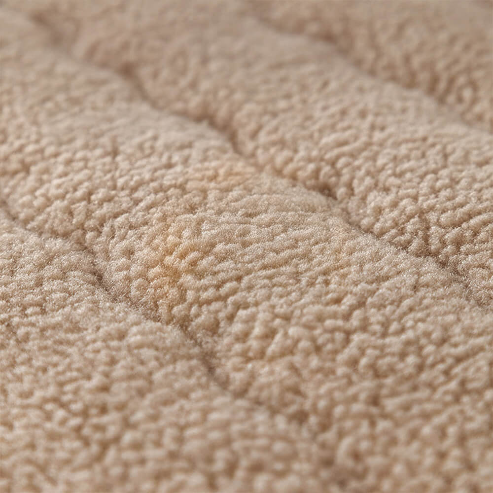 Top-down view of a plush lambskin feel sectional cover, fitting snugly on furniture