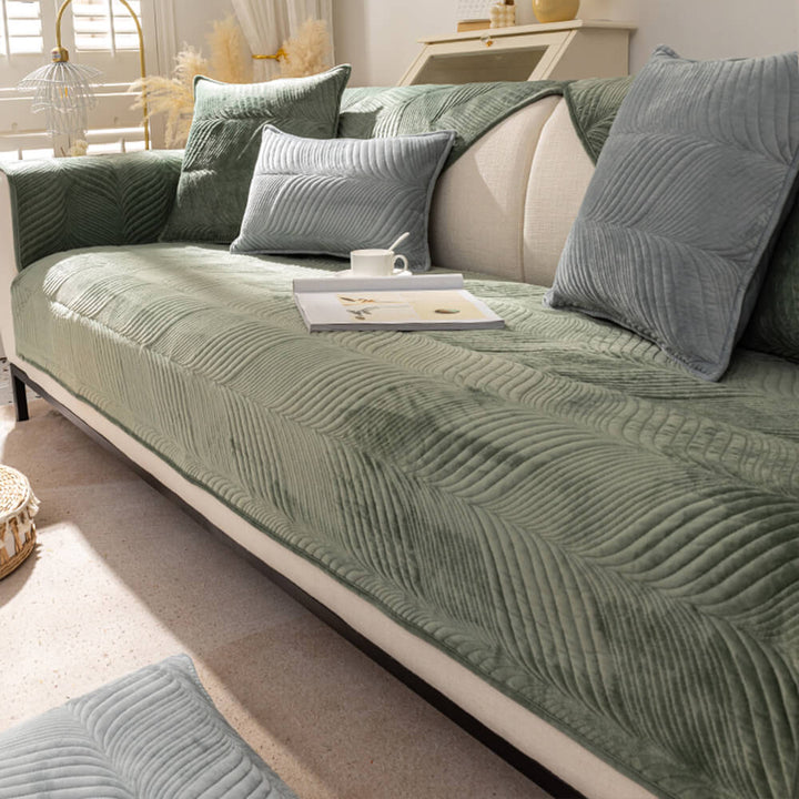 Accent piece: leaf pattern plush couch cover, offering both style and non-slip furniture protection.