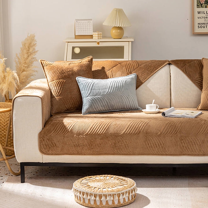 Comfortable plush sofa cover with elegant leaf pattern, providing non-slip security for furniture.