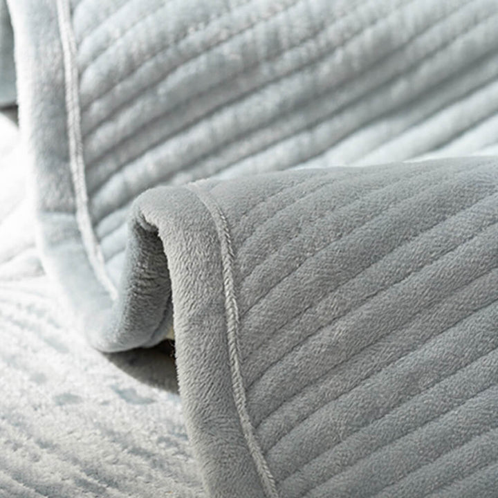 Warm and inviting plush leaf pattern sofa cover, perfect as a non-slip home decor accent.